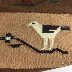 Handwoven wool table runner with bird design